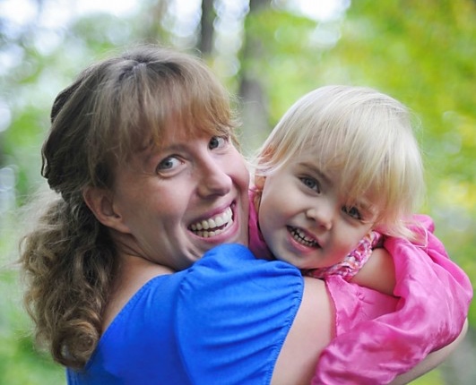 Jenny Corbett, Betheda Placenta Encapsulation specialist, holding her young daughter